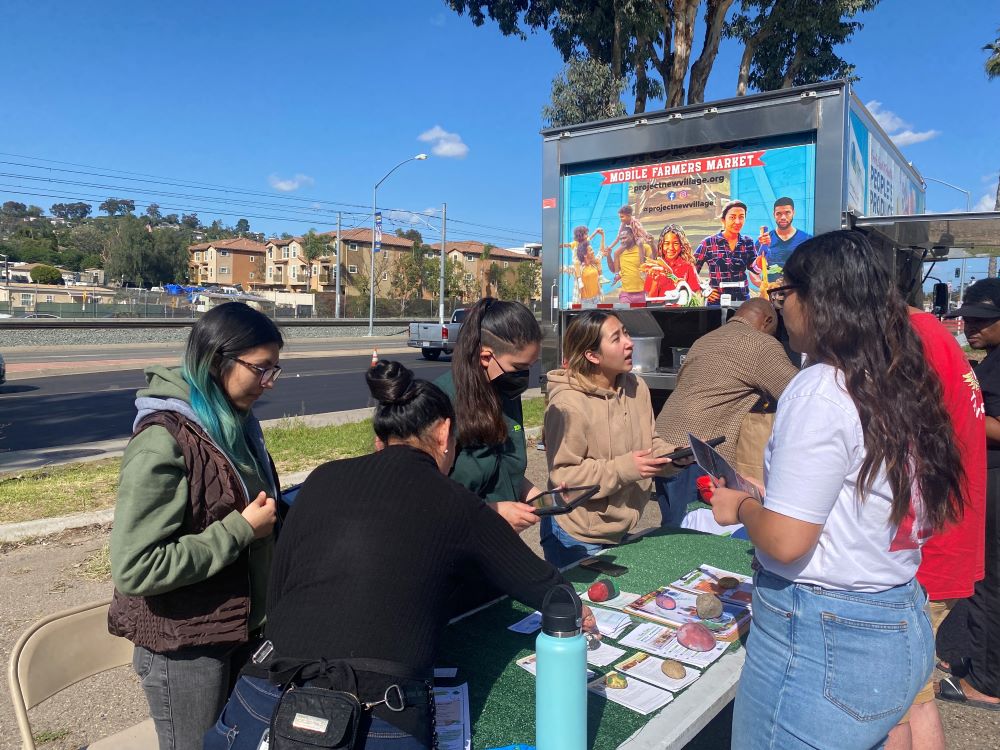 DPD students volunteering at a Mobile Farmers Market