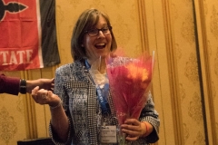 Faculty Member receiving flowers