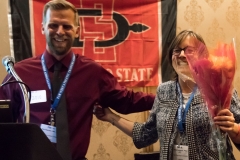 Faculty Member receiving flowers