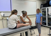 Kim Detwiller Stretching patients calf muscle