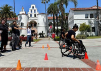 Person in wheelchair navigating a cone course