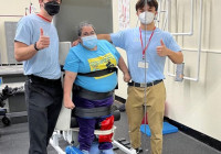 Students with patient posing for photo