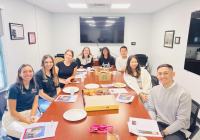 Students having a meeting at an oval table