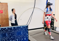 Patient wearing VR headset on a VR treadmill walker