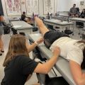 Student testing leg flexibility angle