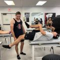 Student stretching knee