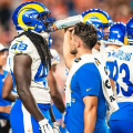 Student giving LA Rams player water