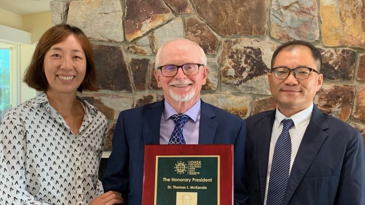 Dr. Thom McKenzie receiving President award