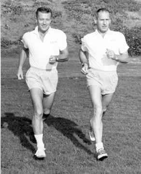 Dr. John L. Boyer and Dr. Frederick W. Kasch running together on a field